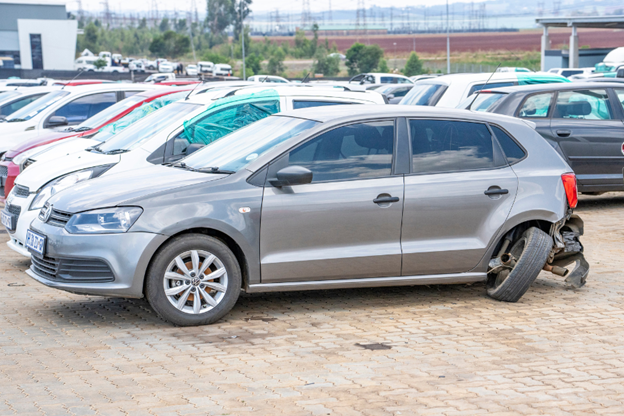 A damaged grey VW polo is sold to Sell Your damaged car with ease.