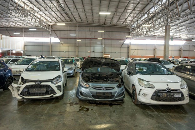 a variety of scraped cars ready for salvage buyers.