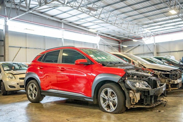 a red damaged car sold to sell your damaged car