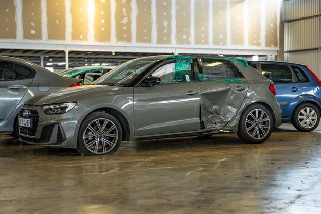 Modern grey Audi with significant accident damage that Sell Your Damaged Car purchases as a damaged vehicle.