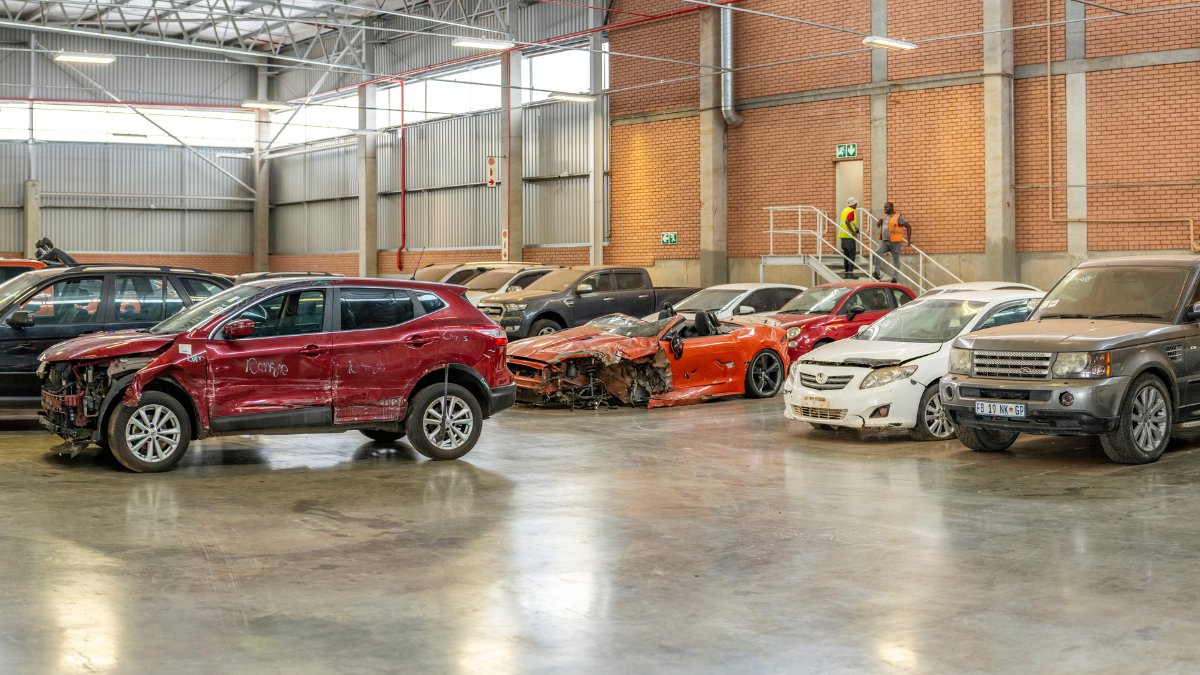 Accident-damaged financed cars stored in a salvage warehouse