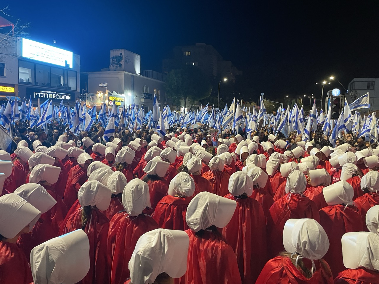 Demonstration against judicial reforms in Haifa, 11 March 2023. The photo shows women protesters dressed in costumes from the TV series ‘The Handmaid’s Tale’ protesting against attempts by ultra-Orthodox parties to exclude women from public life and discriminate against them. About 50,000 people took part in the demonstration
